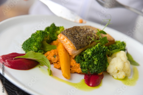 Fish dish served on a white plate.