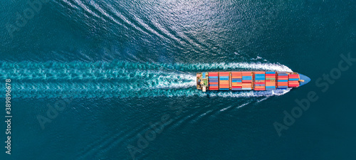 Aerial top view of cargo ship with contrail in the ocean sea ship carrying container and running from container international port smart freight shipping by ship service, webinar banner