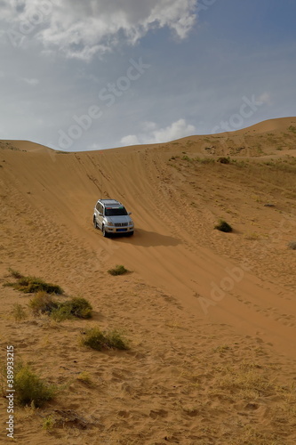 Gray off-road car in the sand. Badain Jaran Desert-Inner Mongolia-China-1082