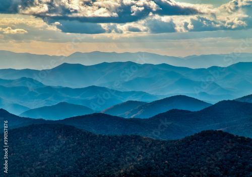 A wide landscape of the Blue Ridge Mountain layers with clouds in HDR.