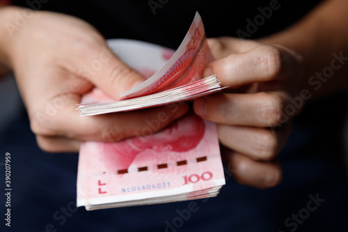 Man counts yuan. Currency of the China - One red hundred renminbi or yuan notes