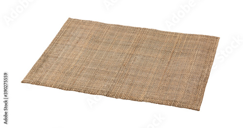 A woven luncheon mat on a white background