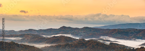 Autumn panorama from South Styrian wine route in Austria at hills in Slovenia during sunraise.