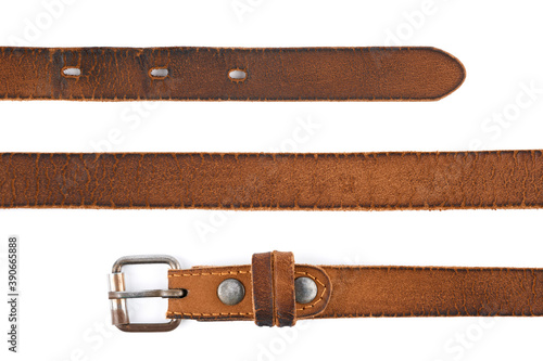 Old leather men's belt on a white background. Brown belt for men. Brown leather belt for trousers and jeans. Male accessory. Vintage things. 