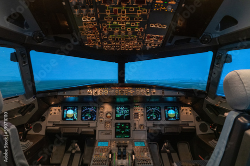 modern airplane cockpit in a full flight simulator - a state of the art training device 