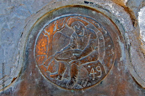 Circular inlay with miner panning for gold commemorating the California Gold Rush of 1849 above Historical landmark plaque 