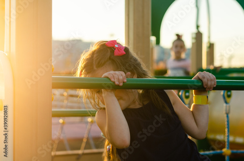 cute little girl child climbing stairs in the playground