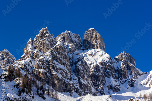 The 'Bishop's Mitre' (Bischofsmuetze) mountain peak covered in snow with blue sky in the background (Filzmoos, Salzburg County, Austria)