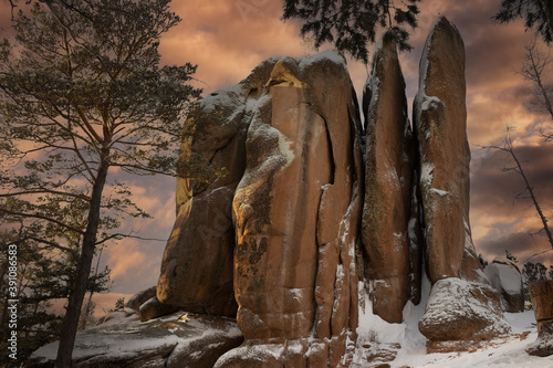 Feathers Rock in the Stolby Nature Sanctuary the city of Krasnoyarsk, Russia, Siberia. Majestic dusk at winter landscape.