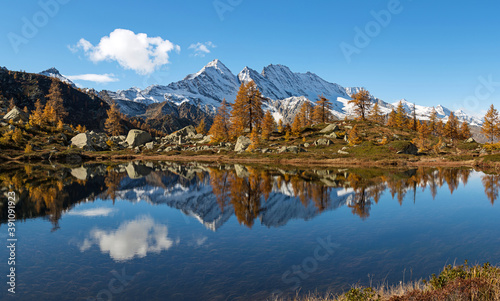 Scenic autumn mountains landscape with alpine lake. Gran Paradiso National Park. Italy