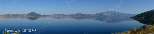 Mountains and lake panoramic view on a beautiful sunny day,