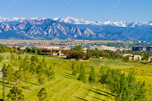 Interlocken Business Park with housing development in background, in Broomfield, looking toward Boulder, the flatirons, and the Indian Peaks, Broomfield County, Colorado