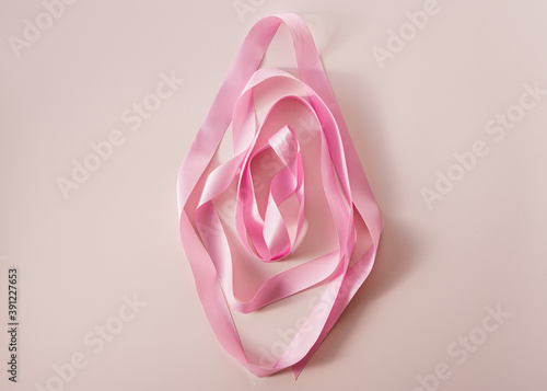 Creative art photography made of pink ribbon. Vagina concept, female energy