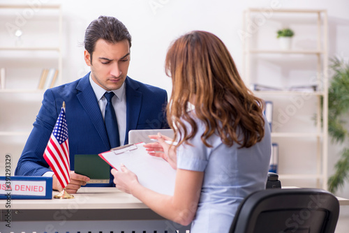 Young woman visiting american embassy for visa