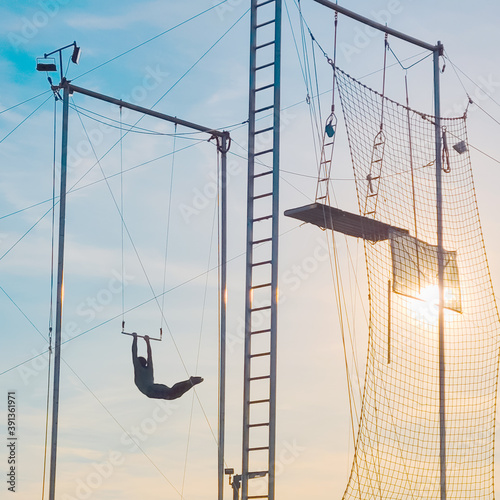 Trapeze artist performing outside In Eisenhower Park