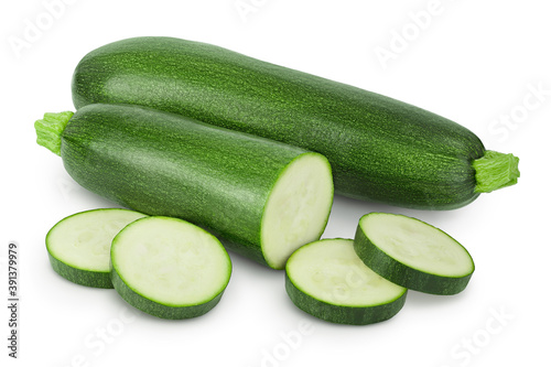 Fresh whole and sliced zucchini isolated on white background with clipping path and full depth of field