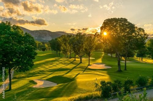 The sun sets over a New Hampshire golf course