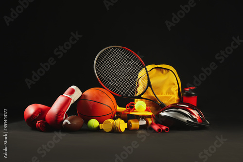 Set of sport equipment on dark background