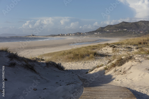 Beautiful shot of a footpath leading to Larino Beach in Galicia Spain