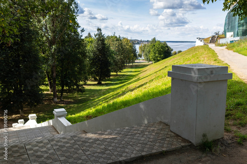 Kostroma. Summer day on the Bank of the Volga. Panorama of the river and old stairs and fences in Central Park.