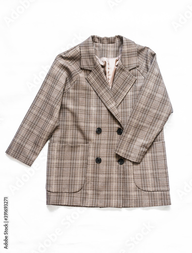 Women's plaid blazer on a light background, top view