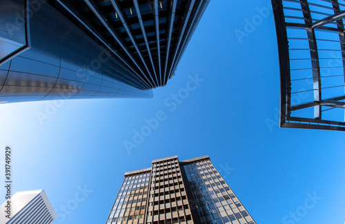 view playing with the perspective of several office skyscrapers, AZCA business and financial district in Madrid, Spain.