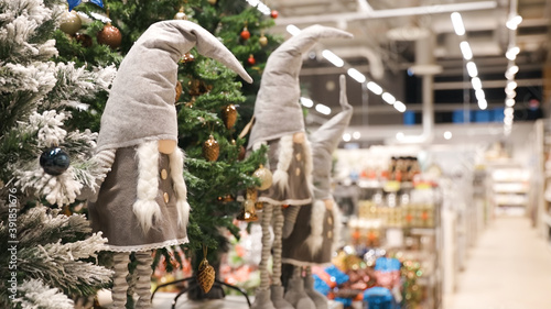 Two grey Christmas dwarf toys for Christmas decoration in shop