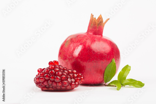 Pomegranate in composition in studio on white background