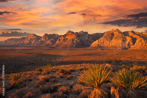 Orange first rays of dawn light on the cliffs of Red Rock Canyon National Conservation Area nea Las Vegas Nevada.