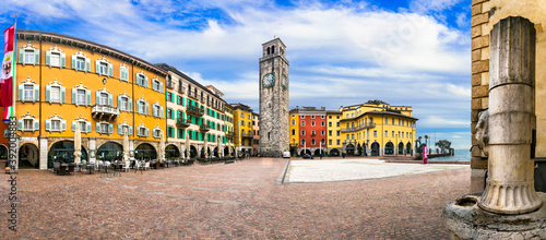Riva del Garda - charming popular town in Garda lake. Colorful houses and old tower in downtown. Italy, Tentino