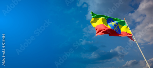 Beautiful national state flag of Ethiopia with blank space. Ethiopia flag on wide background with place for text 3D artwork.