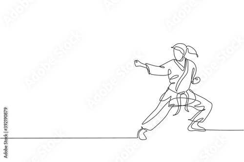 One single line drawing of young sporty karateka girl in fight uniform with belt exercising martial art at gym vector illustration. Healthy sport lifestyle concept. Modern continuous line draw design