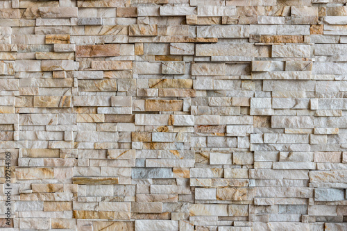 The stone wall texture background natural color. Background of stone wall texture photo. Natural stone wall texture for background. Old Brick texture, Grunge brick wall background.
