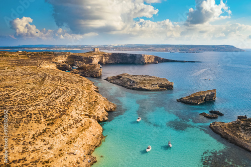 Aerial drone view of Comino island, Blue lagoon and boats. Malta