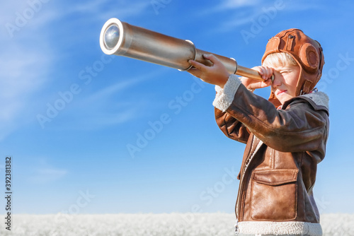 Young aviator with a telescope