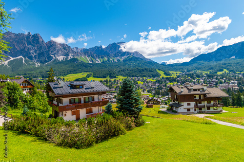 Tourist huts in Cortina d'Ampezzo on a sunny summer day, Dolomites mountains, Italy