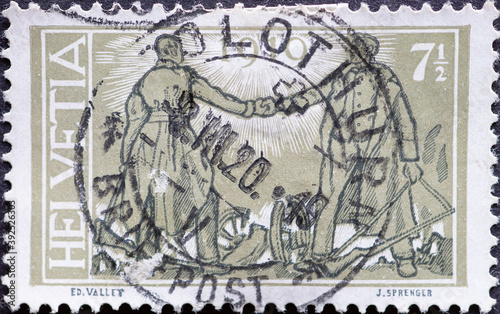 Switzerland - Circa 1919 : a postage stamp printed in the swiss showing a handshake by two soldiers. Occasion peace treaty