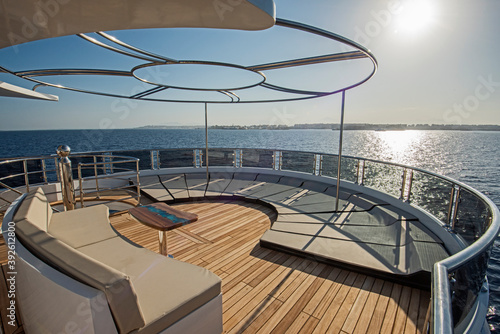 Table and chairs on deck of a luxury motor yacht