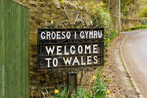 Bilingual welcome to Wales sign in Welsh and English marking the border between England and Wales