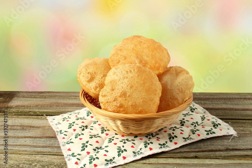 indian traditional food puri or poori fried roti in blur bokeh background