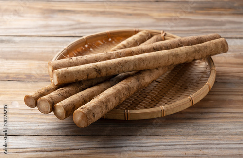 A burdock on a wooden board background