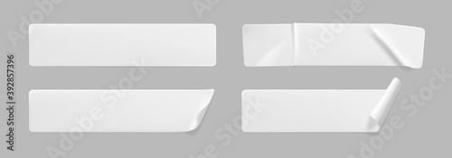 White glued crumpled stickers with curled corners mock up set. Blank white adhesive paper or plastic sticker label with wrinkled and creased effect. Template label tags close up. 3d realistic vector