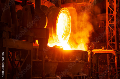 Hot slag is poured into slag trucks. Steel production in a metal smelting workshop.