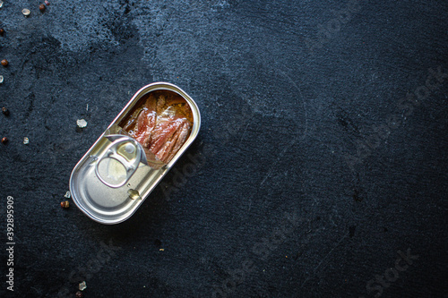 anchovies canned fish in a tin can seafood sardine top view copy space for text food background rustic diet pescetarian