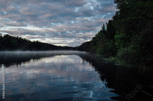 Mist on The Spanish River in Massey Ontario with cloudy sky