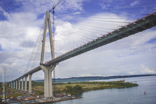 Atlantic bridge in Panama canal by Gatun locks still work in progress. Crane on the bridge.