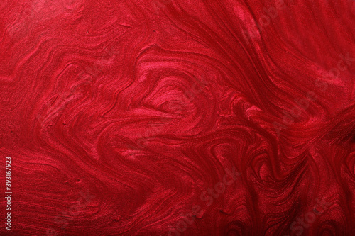 Red shimmer and glitter abstract background. Make up concept.Beautiful stains of liquid nail laquers.Fluid art,pour painting technique.Horizontal banner,can be used as backdrop for chat.