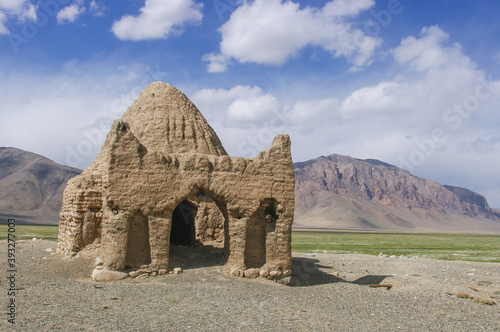 Landscape view of old caravanserai or Chinese tomb surrounded by mountains at Bash Gumbaz near Alichur, Gorno-Badakshan, Tajikistan Pamir