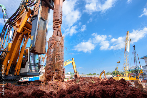 Earth drilling machine or hydraulic boring machine into a construction site for drilling piles.