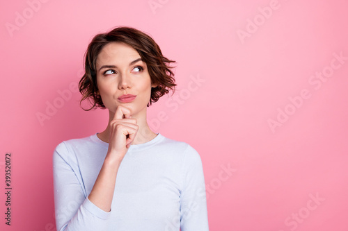 Focused smart girl look copyspace touch hand chin think decide wear pullover isolated pastel color background